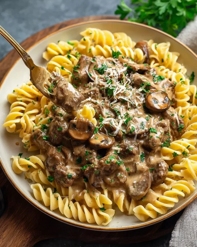 Mushroom Dairy-Free Beef Stroganoff served in a bowl with fresh herbs